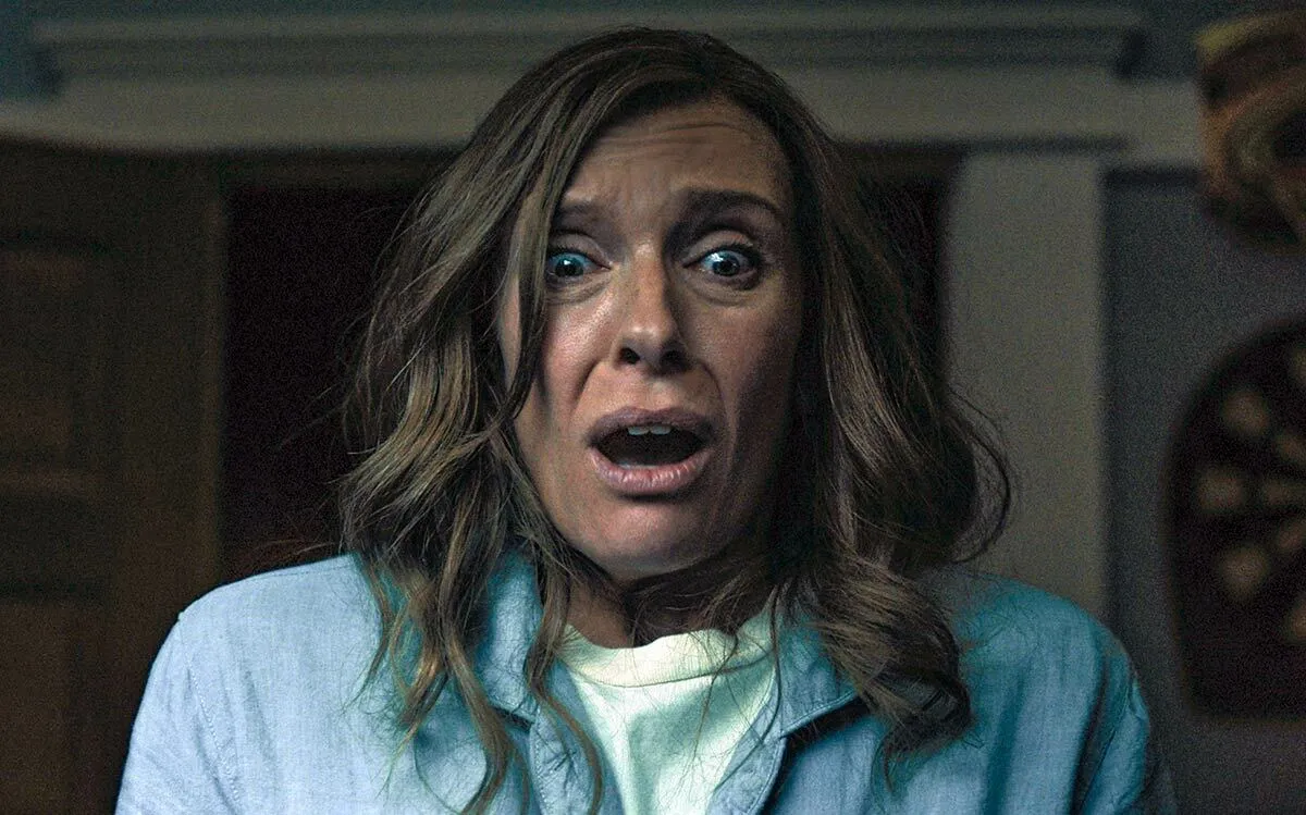 Toni Collette wearing a blue shirt in the film Hereditary