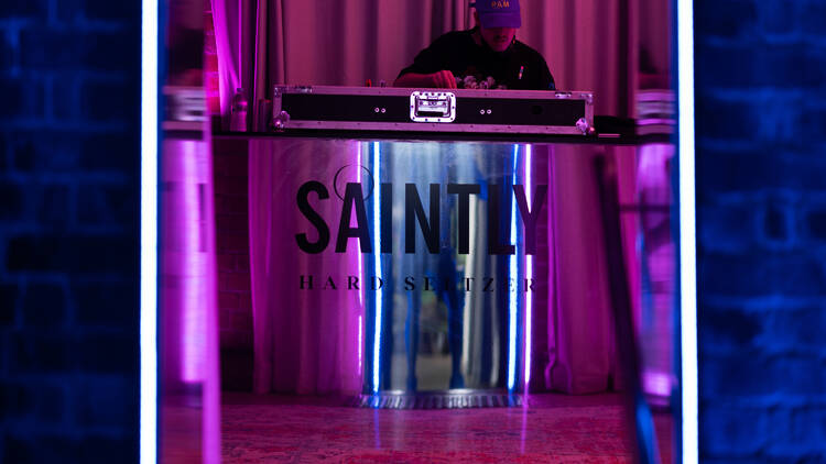 A DJ playing at the decks at the Saintly sacred vaults event.