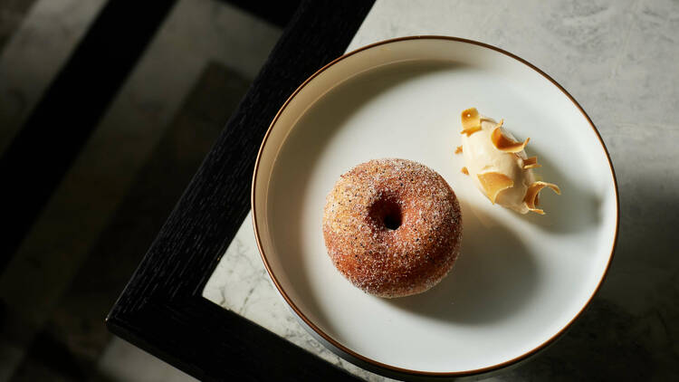 The bombalone, a fried doughnut filled with peach.