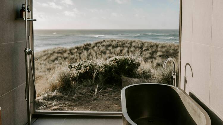 A freestanding bathtub looking out to the ocean