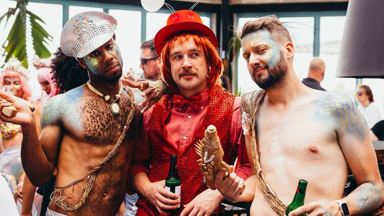 A group of three guys at a Pride event at the Espy.