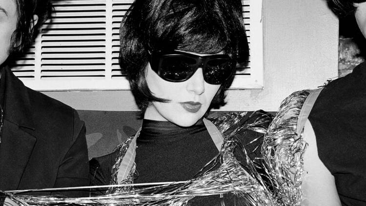 A black and white photo of Karen O of the Yeah Yeah Yeahs.