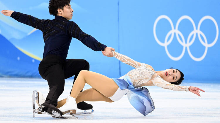 China's Sui Wenjing and China's Han Cong compete in the pair skating free skating of the figure skating event during the Beijing 2022 Winter Olympic Games at the Capital Indoor Stadium in Beijing on February 19, 2022. (Photo by Kirill KUDRYAVTSEV / AFP)
