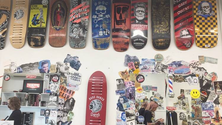 Skateboards attached to the wall of a barber shop