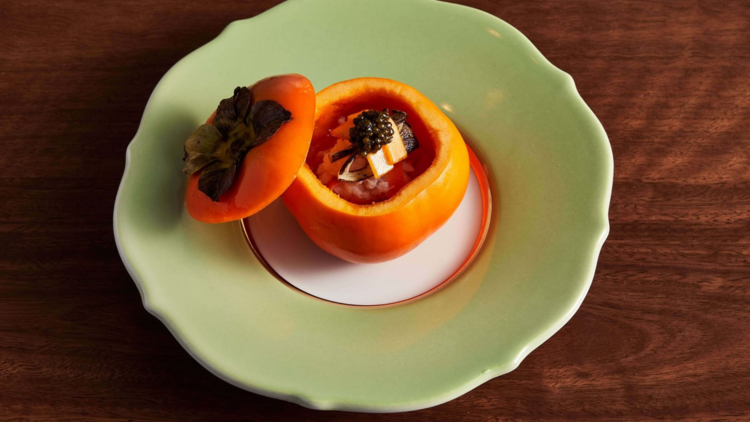 A persimmon with fish and caviar