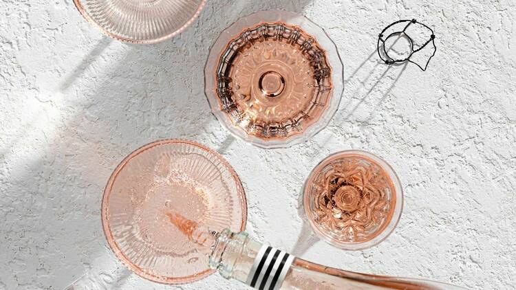 Glasses of rose on a table. 
