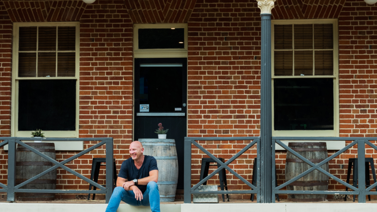 Matt Moran sits on the steps of the Rockley Pub