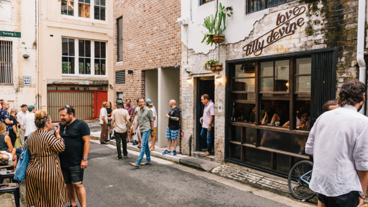 A crowd gathered in the laneway outside Love, Tilly Devine