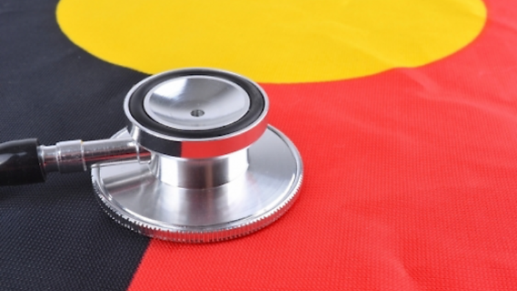 A stethoscope over an Aboriginal or Indigenous flag, with the colours black, gold and red.