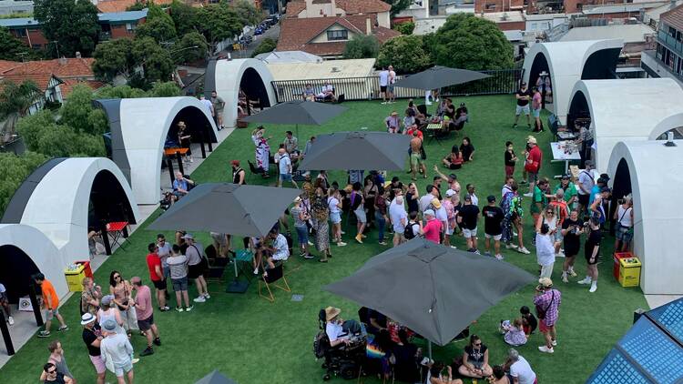 An aerial overview of a market session at the Victorian Pride Centre.