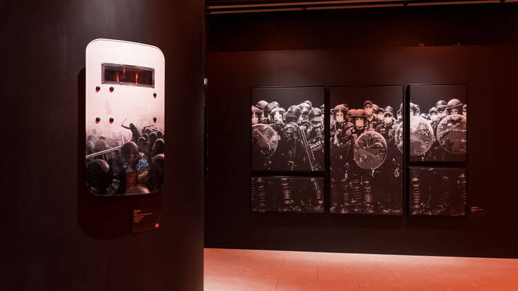 Edge of Chaos exhibition. Police shields painted with artwork of police. 