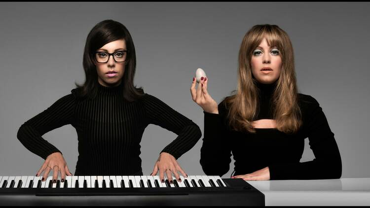 Comedians Flo and Joan at a keyboard