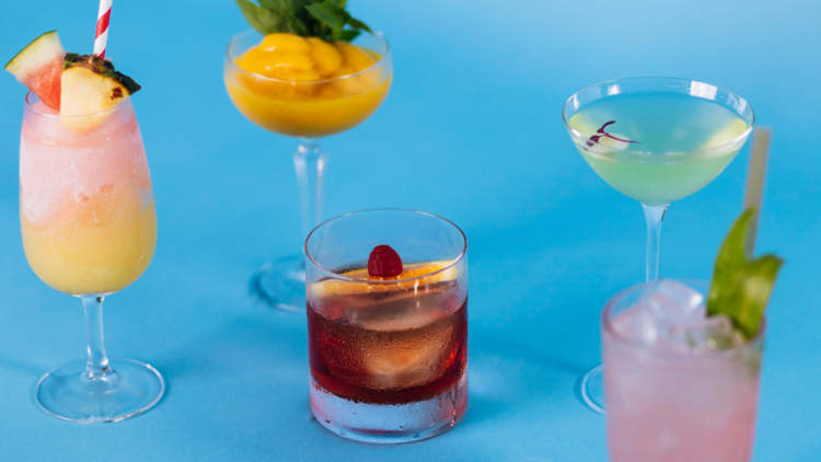 5 cocktails on a blue background