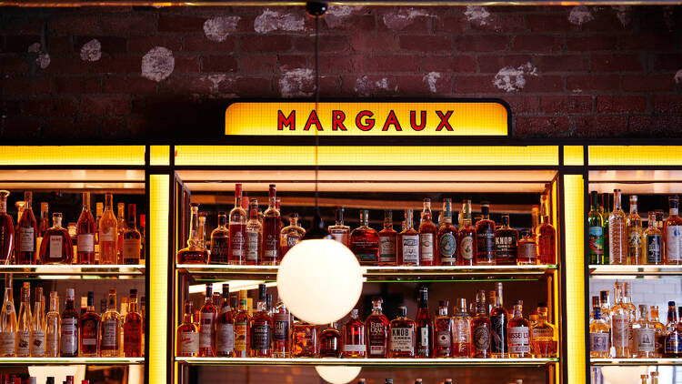 The liquor cabinet behind the bar at Bar Margaux.