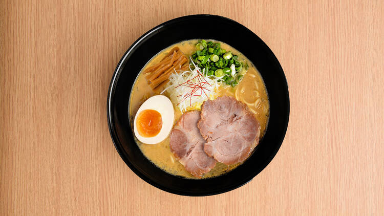 A bowl of ramen photographed from above.