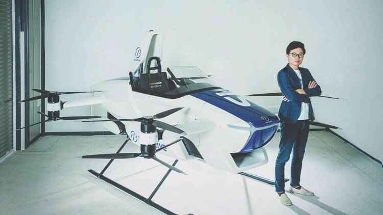 Tomohiro Fukuzawa pictured with SkyDrive’s SD-03 prototype 