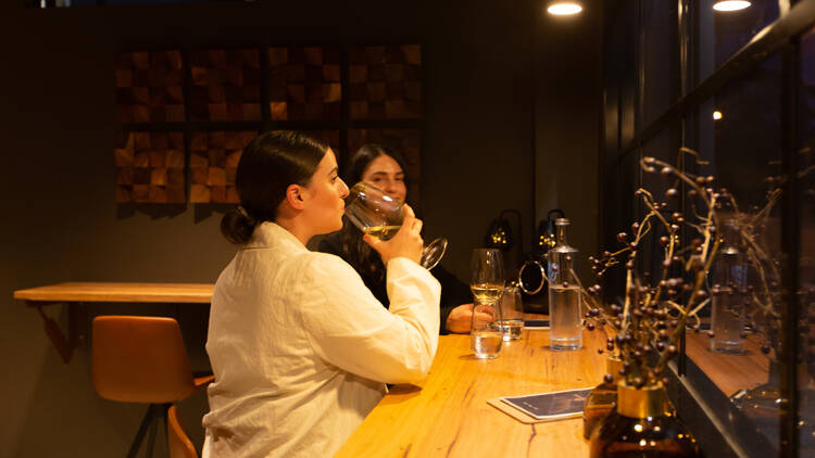 Two women sampling wines at Primrose and Essendon.