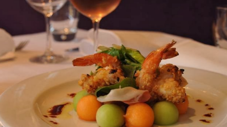 A dish of fried prawns on melon balls at Bistro Thierry.