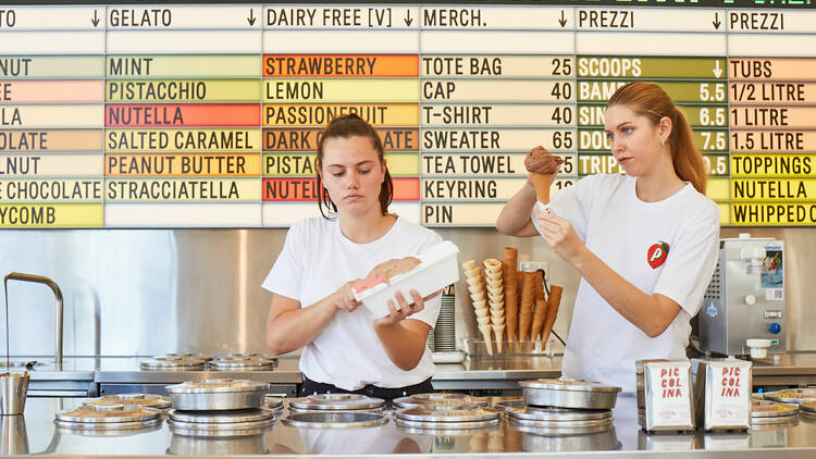 Two girls scoop ice cream inside Piccolina Hawthorn