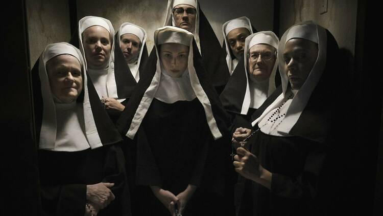 A still from Agnes; a group of nuns staring at the photographer.