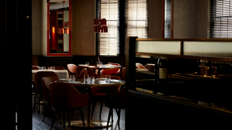 the interior of gowings, wooden floorboards and pink velvet chairs