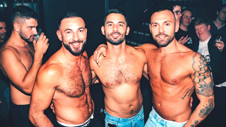 Three shirtless men at Deja Vu at Universal