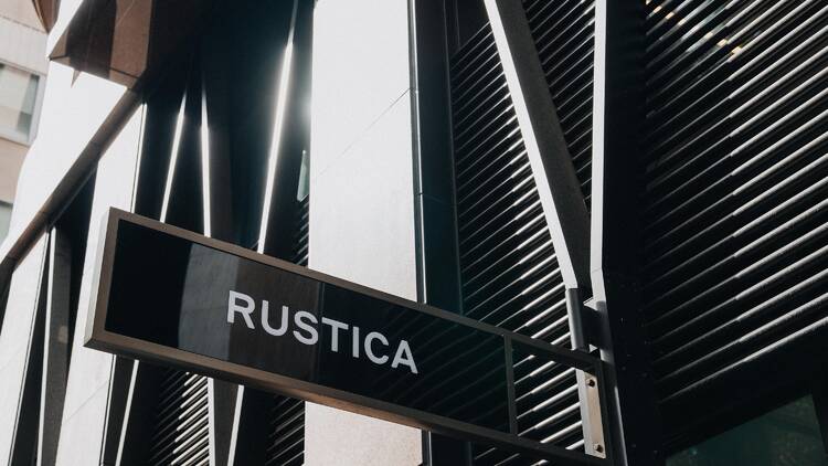 A black and white sign that says Rustica.