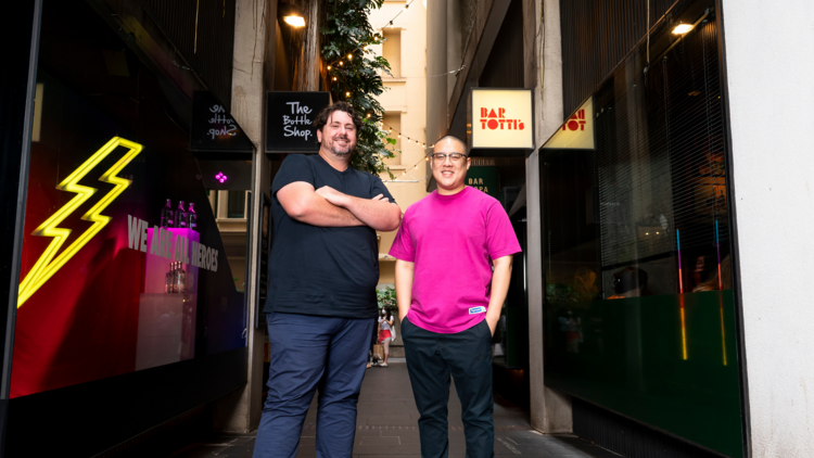 Dan Hong and Mike Eggart stand in a laneway next to Bar Tottis