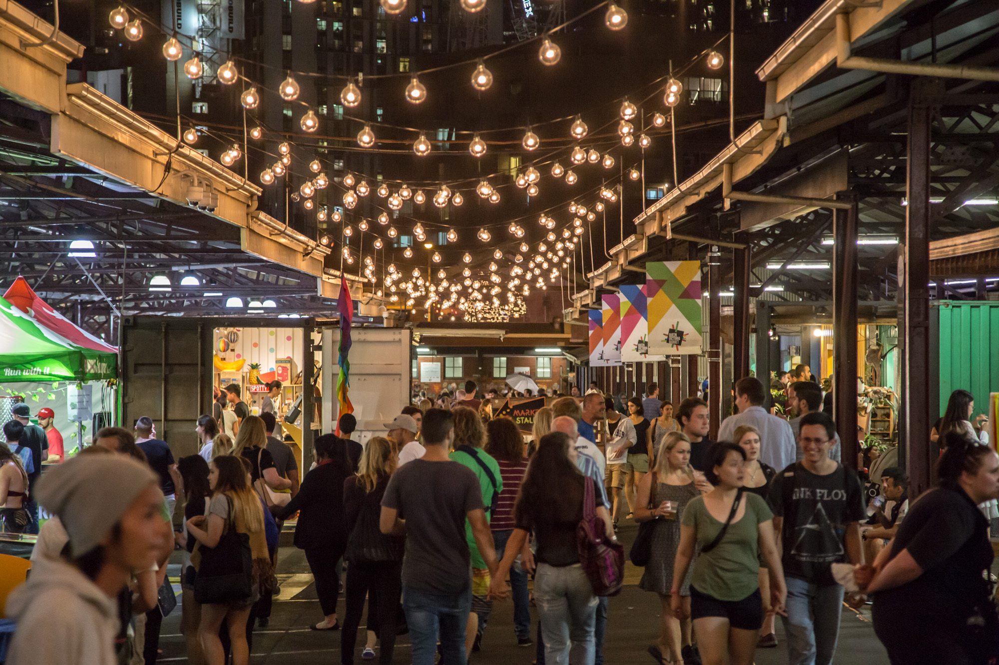 People wandering through the Queen Victoria winter night market.