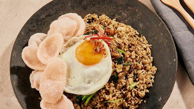 A rice, egg and prawn cracker dish.