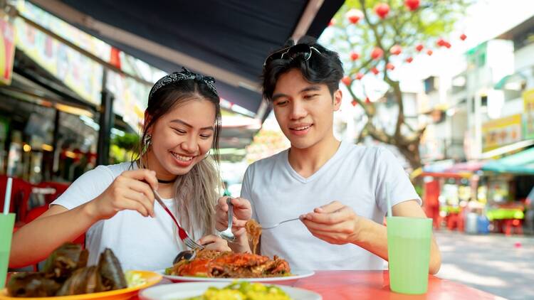 A couple enjoying street food