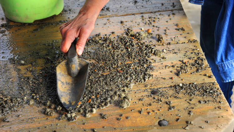 Visitor to the Crater of Diamonds State Park in Arkansas, shovels through his dirt and rocks hoping to find a diamond.