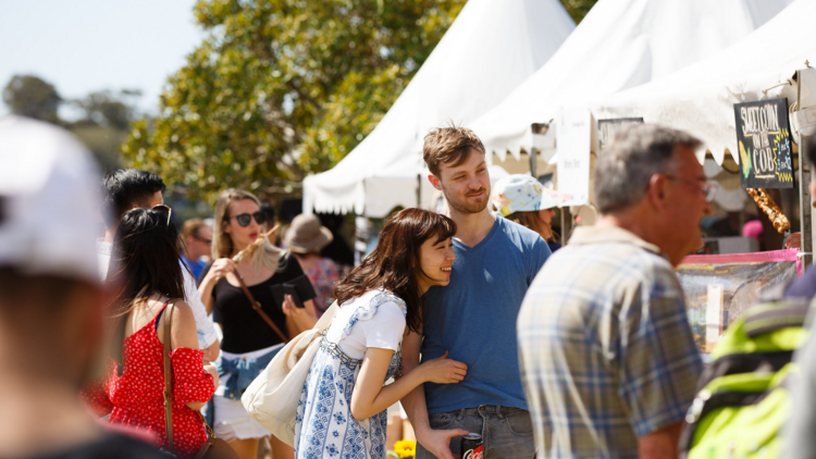 A couple laugh together at the Pyrmont Festival