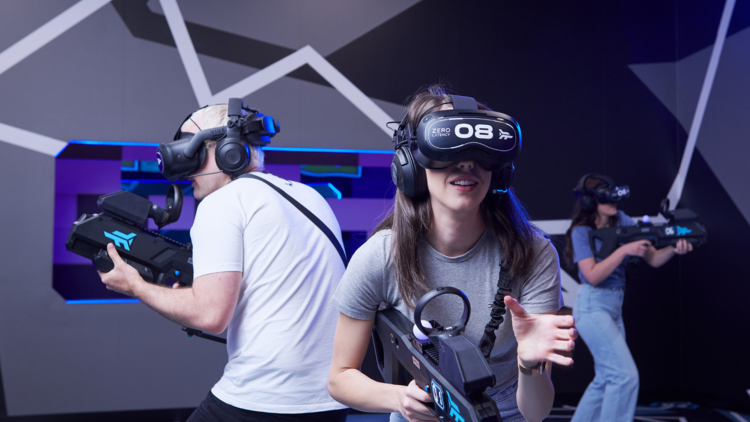 A group of friends playing VR laser tag.