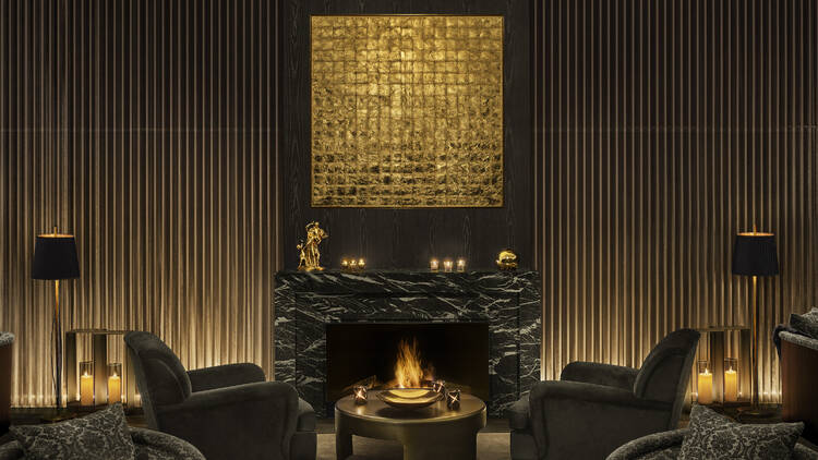 Fireplace at Gold Bar with gold-leaf artwork