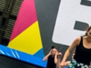 Jump around at an indoor trampoline park Jump around at an indoor trampoline park