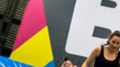 Jump around at an indoor trampoline park Jump around at an indoor trampoline park