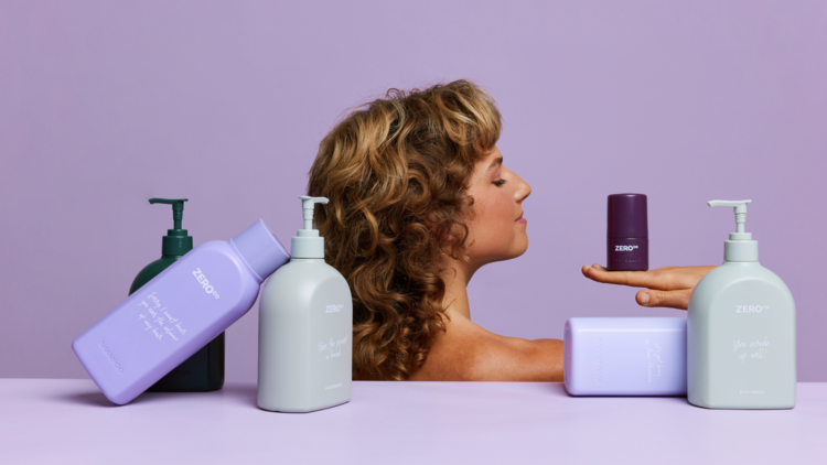 A woman in the background with heaps of eco-friendly body care products.