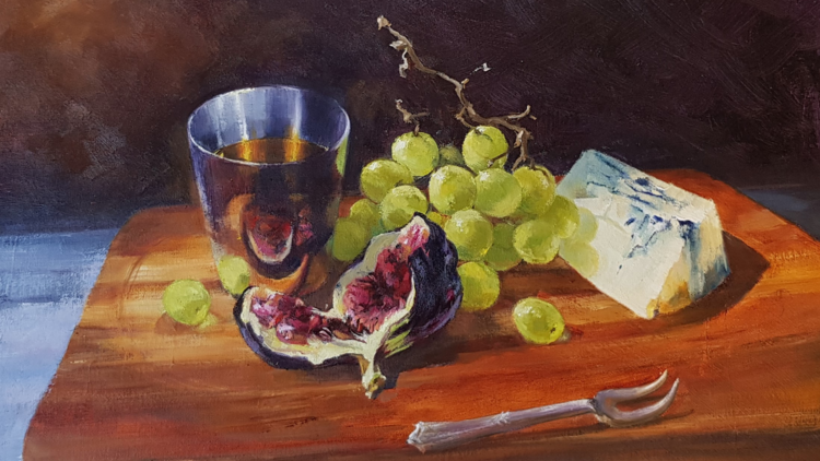 A plate of figs, grapes, blue cheese and whisky