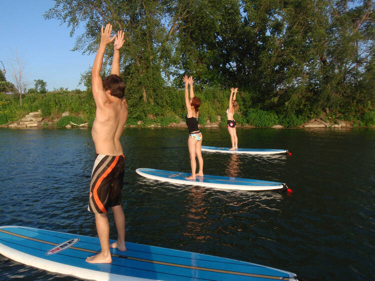 Try paddleboard yoga in the St. Lawrence