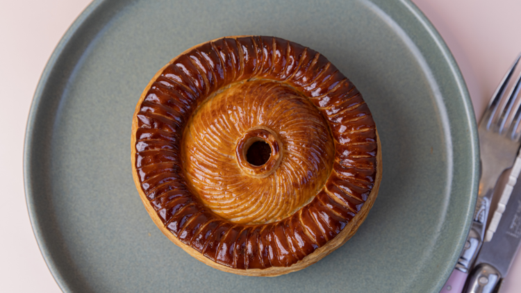 Flat lay of a glazed Lode chicken pie