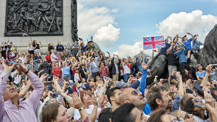 The Trafalgar Square crowds watch the Red Arrows flypast, Thursday June 2 2022