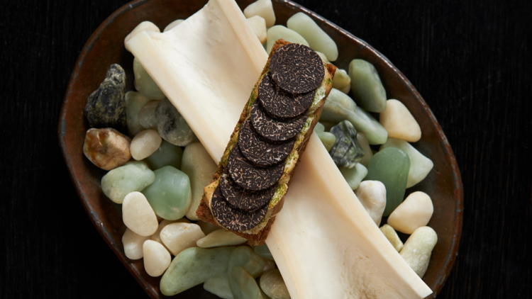 A shin bone with a crouton and truffle