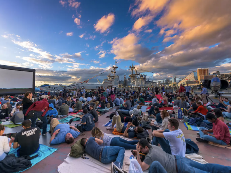 See a movie on an aircraft carrier