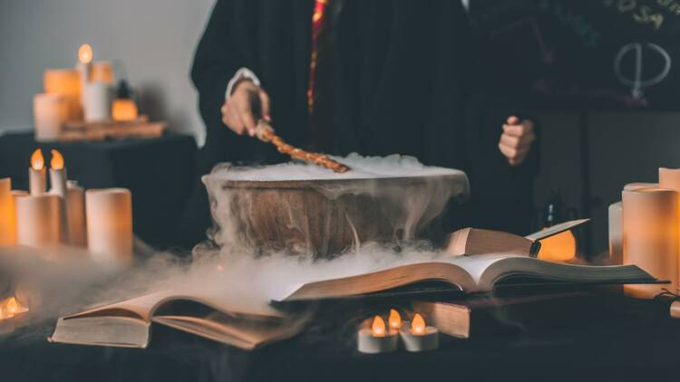 A wizard brewing a potion in a cauldron.