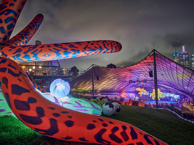 A huge octopus-like sculpture sits in the foreground of the Sidney Myer Music Bowl