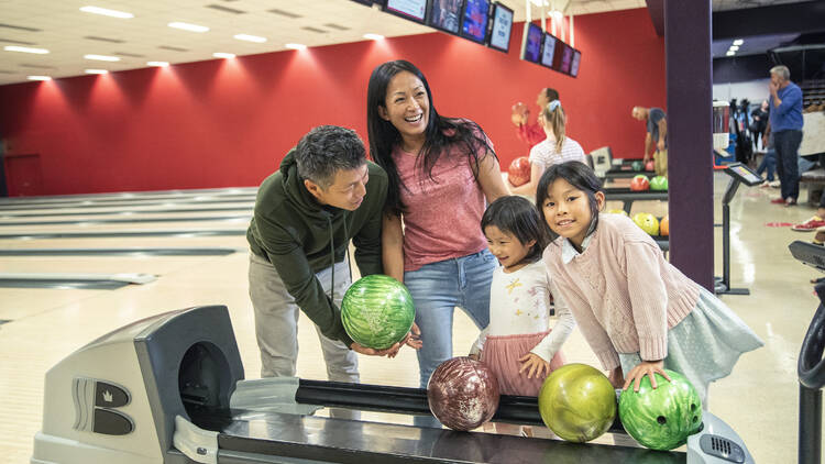 A family at a bowling alley.