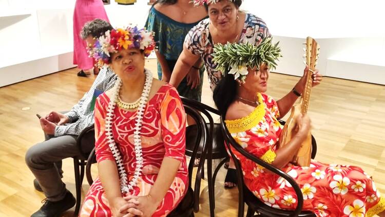 Cook Island ukulele ensemble performing in traditional dress