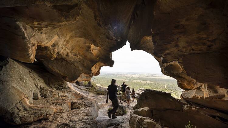 A group of travellers exploring caves.