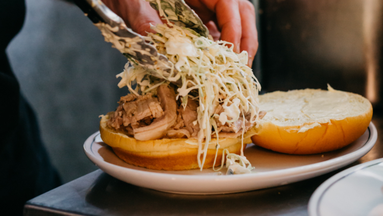 A porchetta roll with cabbage slaw